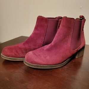 Burgundy suede Chelsea boots.